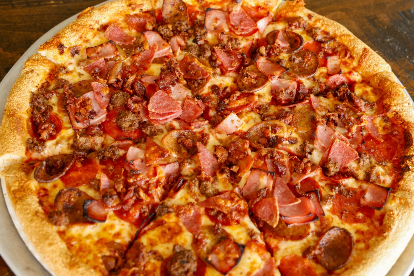 Meat Lovers pizza loaded with pepperoni, sausage, ham and bacon